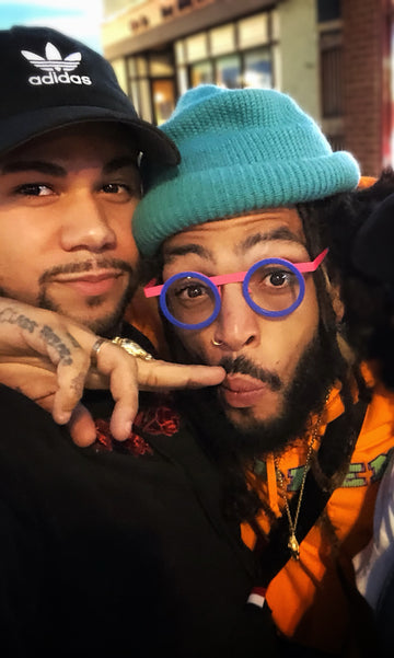 Joseph Brooks and his cousin Travie McCoy (Gym Class Heroes)